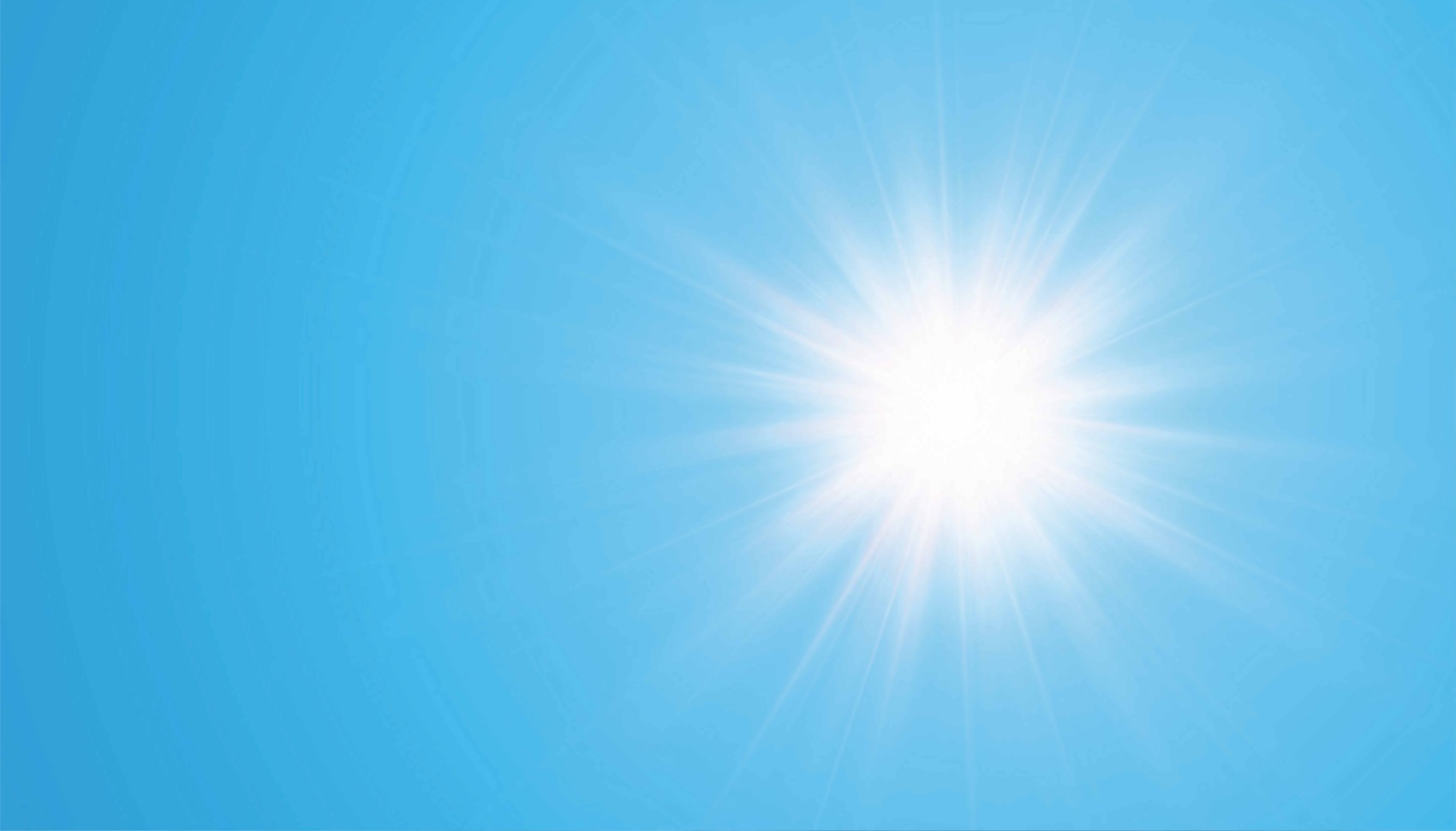 Sonne steht auf blauem Himmel